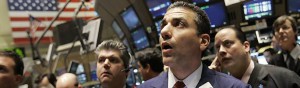 Trader Vincent Vincent Quinones, foreground right, gathers with other traders on the floor of the New York Stock Exchange, Tuesday March 18, 2008.  Wall Street gave up some of its steep gains Tuesday while investors digested the Federal Reserve's decision to cut interest rates by three-quarters of a percentage point. Many investors had expected a cut of a full percentage point. (AP Photo/Richard Drew)